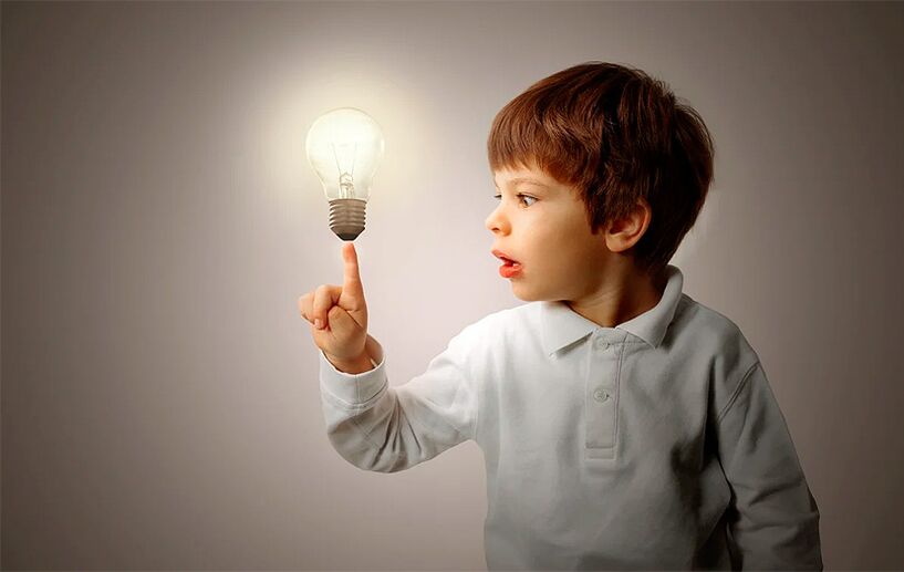 A boy with an incandescent lamp
